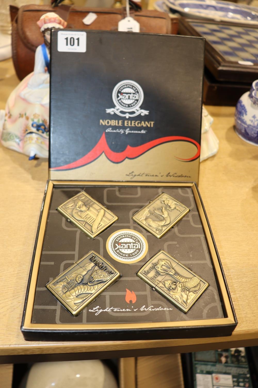 A NEW & BOXED SET OF FOUR LIGHTERS