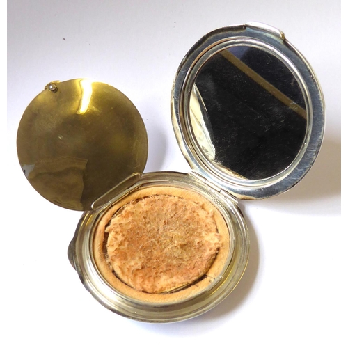 207 - AN ART DECO SILVER CIRCULAR COMPACT
With engine turned decoration, geometric initials cartouche and ... 