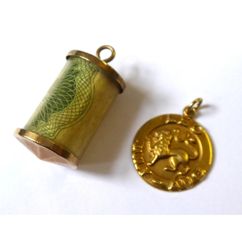 211 - A VINTAGE 9CT GOLD JULY-AUGUST ASTROLOGY CHARM
Embossed with a lion, together with a 9ct charm conta... 