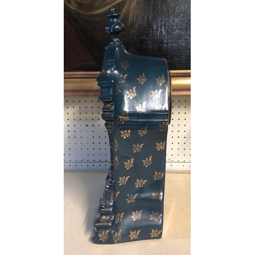 275 - A LATE 19TH CENTURY FRENCH CHINA CASED MANTLE CLOCK
With gilt and enamelled dial above a decorated p... 