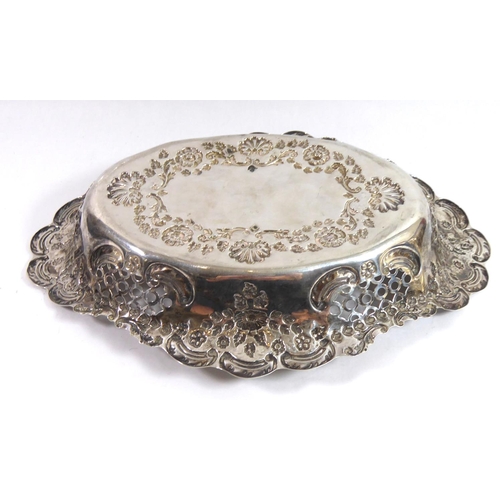 266 - WILLIAM J HOLMES, A LATE VICTORIAN SILVER CAKE BASKET
With floral repousse decoration and pierced si... 
