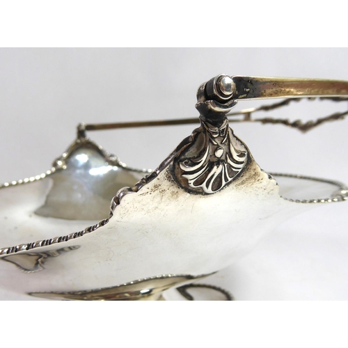 270 - JOSIAH WILLIAMS & CO., AN EARLY 20TH CENTURY SILVER CAKE BASKET
Having a gadrooned edge broken up by... 