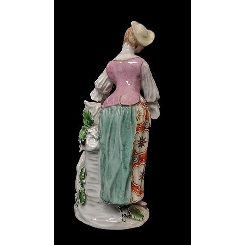 358 - DERBY, A PORCELAIN FIGURE OF A SHEPHERDESS, CIRCA 1765
Placing a garland around the neck of a rearin... 