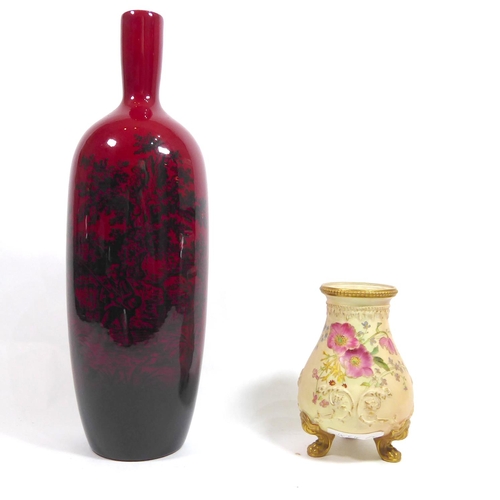 375 - ROYAL DOULTON, A FLAMBÉ PORCELAIN BOTTLE VASE
The red ground decorated in woodcut pattern (pattern n... 