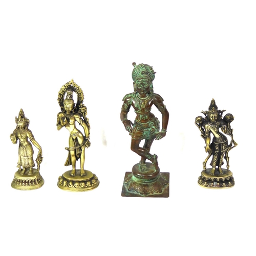 102a - AN EARLY 20TH CENTURY SOLID BRONZE STATUE OF A HINDU GOD 
Along with three white metal Hindu statues... 