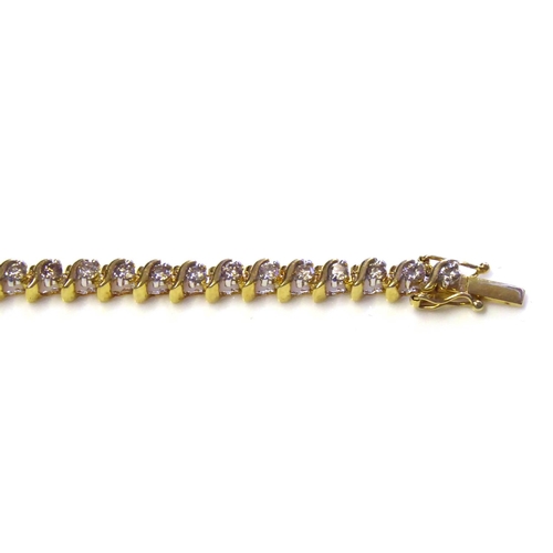 74 - AN 18CT GOLD AND DIAMOND TENNIS BRACELET
The single row of round cut diamonds in a half twist mount.... 