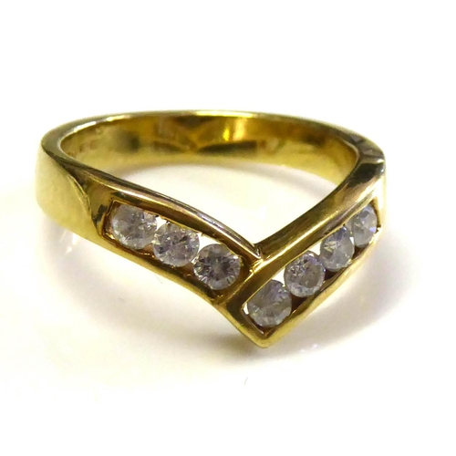 75 - AN 18CT GOLD AND DIAMOND WISHBONE RING
Having a single row of round cut diamonds (size L/M).