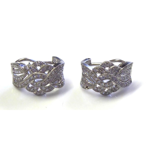 93 - A PAIR OF 18CT WHITE GOLD AND DIAMOND EARRINGS
Pavé set stones in a twist design.
(approx 1.5cm x 2c... 