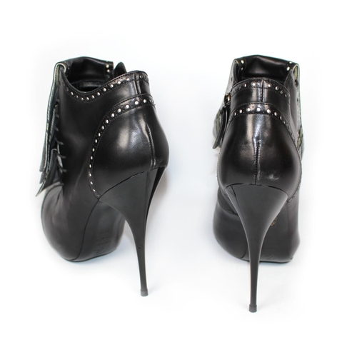 177A - ALEXANDER MCQUEEN, BLACK LEATHER ANKLE BOOTS  
With side zip and three front leather flaps covering ... 