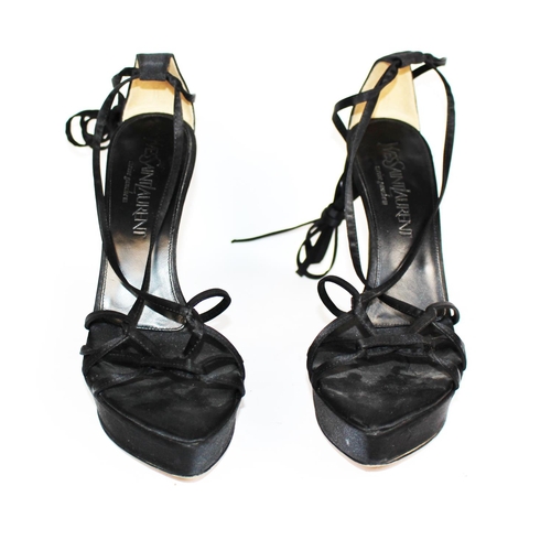 200 - BALENCIAGA, A PAIR OF BLACK LEATHER HEELS
Open toe and strap design, Size 39, sold together with a p... 