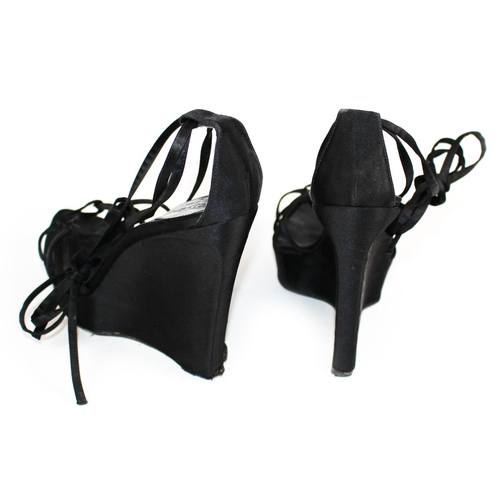 200 - BALENCIAGA, A PAIR OF BLACK LEATHER HEELS
Open toe and strap design, Size 39, sold together with a p... 