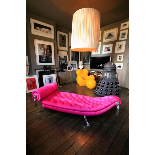 120 - MARK BRAZIER-JONES, B. 1956, JABA DAYBED
Upholstered in a bright pink button back cow hide, raised o... 