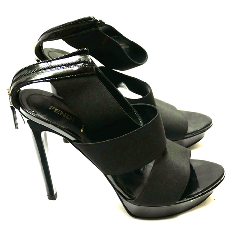 180 - FENDI, A PAIR OF BLACK LEATHER AND CANVAS OPEN TOE STRAP HEELS
(size 39).

Condition: A