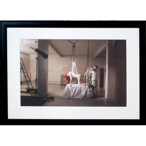 28 - KATERINA JEPP, B. 1962, COLOURED PHOTOGRAPH
Bondage scene, a female hanging horizontal from a hoist,... 