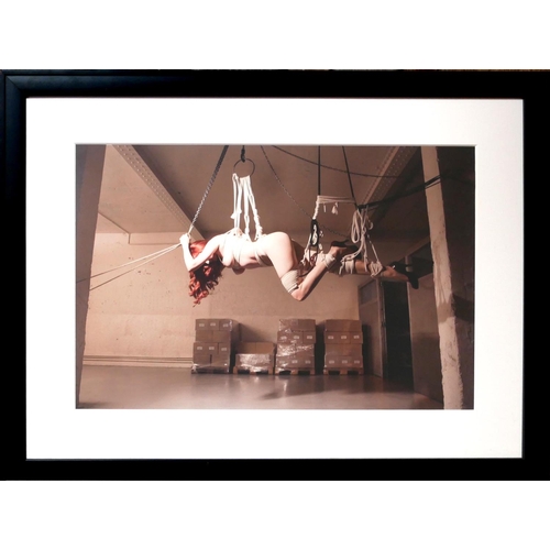 29 - KATERINA JEPP, B. 1962, COLOURED PHOTOGRAPH
Bondage scene, a female hanging horizontal from a hoist,... 