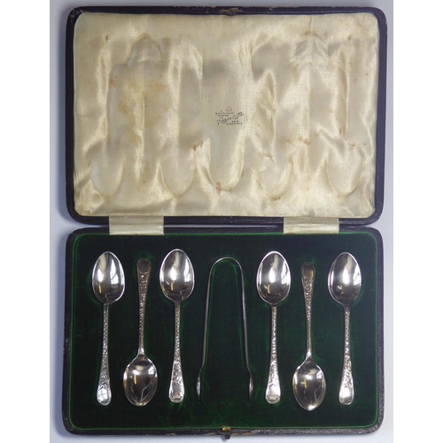 403A - A CASED SET OF EDWARDIAN SILVER TEASPOONS AND SUGAR TONGS
Having engraved decoration and fitted velv... 