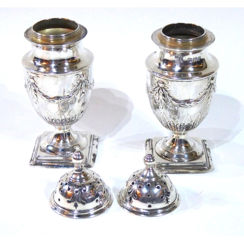 416 - A PAIR OF VICTORIAN SILVER CASTERS
Classical form with embossed swags and bows, hallmarked Atkin Bro... 