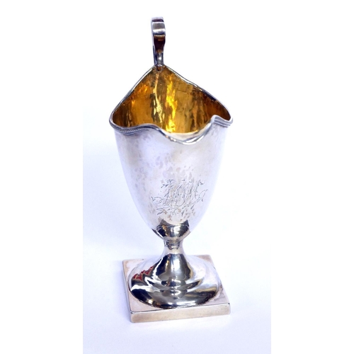 430 - A GEORGIAN SILVER CLASSICAL HELMET FORM CREAM JUG
With beaded rim and gilt interior, hallmarked Lond... 