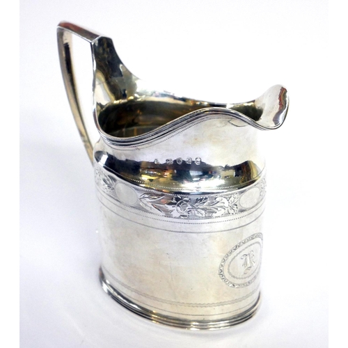 433 - A GEORGIAN SILVER  CLASSICAL FORM CREAM JUG
With fine engraved decoration, hallmarked London, 1803.
... 