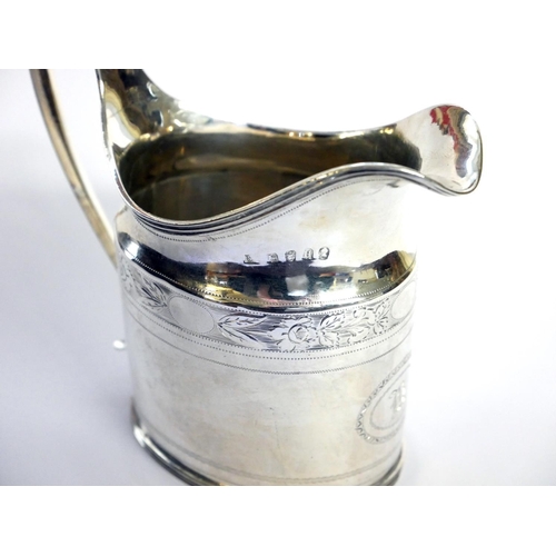 433 - A GEORGIAN SILVER  CLASSICAL FORM CREAM JUG
With fine engraved decoration, hallmarked London, 1803.
... 