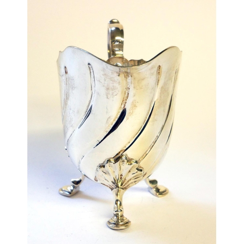 434 - A VICTORIAN SILVER CREAM JUG
Having a fluted body with tripod legs, hallmarked London, 1891.
(approx... 