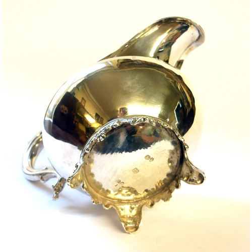 435 - A WILLIAM IV SILVER CREAM JUG
Having a scrolled handle and gilt interior, hallmarked Hoseph and Albe... 