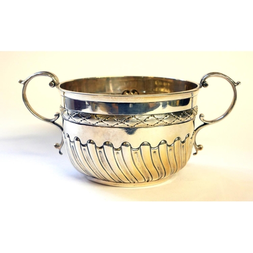 438 - A VICTORIAN SILVER PORRINGER
Twin handles and half flute decoration, hallmarked Daniel and John Well... 