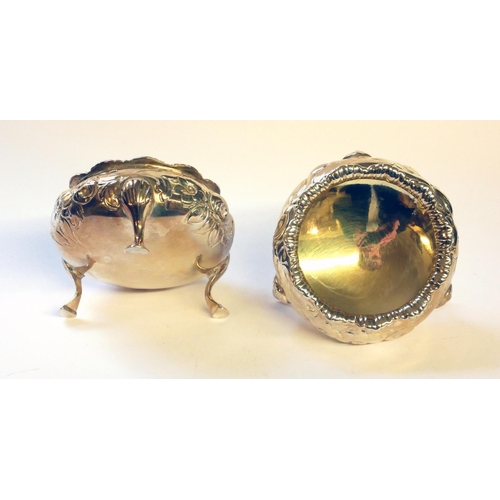 440 - A PAIR OF VICTORIAN SILVER SALTS
Spherical form with embossed decoration and tripod feet, hallmarked... 