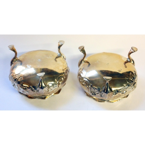 440 - A PAIR OF VICTORIAN SILVER SALTS
Spherical form with embossed decoration and tripod feet, hallmarked... 