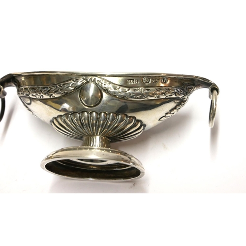 447 - A PAIR OF VICTORIAN SILVER CLASSICAL NAVETTE FORM SALTS
With ring handles and embossed decoration, h... 