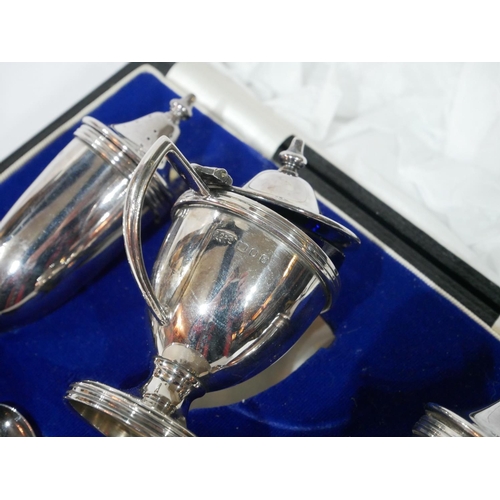 463 - A 20TH CENTURY CASED SILVER CLASSICAL FORM CRUET SET
Comprising of salt, pepper and a mustard pot wi... 