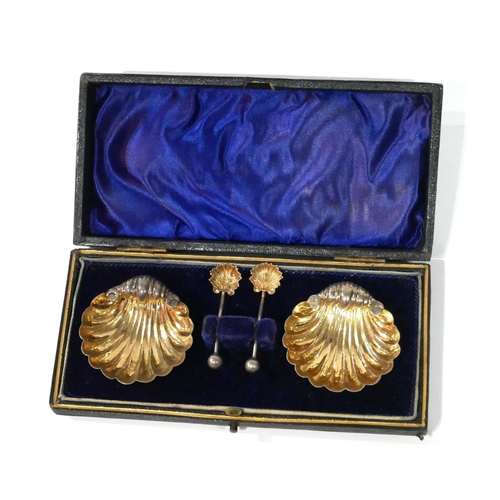 472 - A CASED PAIR OF SILVER SHELL FORM SALTS
With matching spoons, in fitted velvet lined box, hallmarked... 