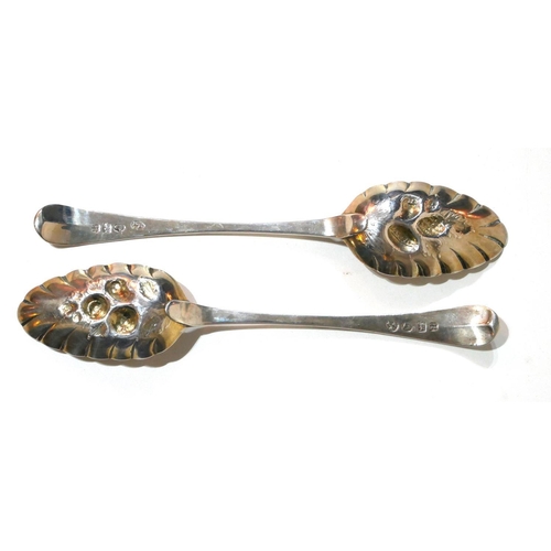 473 - A PAIR OF GEORGIAN NEWCASTLE SILVER BERRY SPOONS
Having fine engraved decoration and embossed fruit ... 