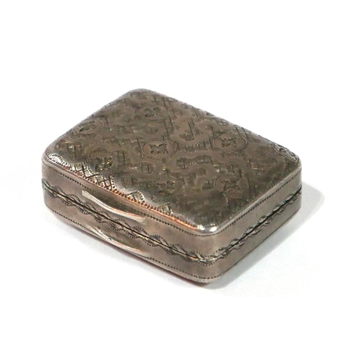 475 - A GEORGIAN SILVER RECTANGULAR VINAIGRETTE
With fine engraved decoration, pierced grill and gilt inte... 