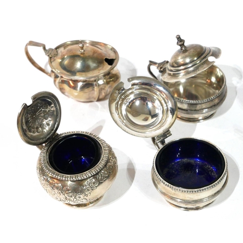 481 - A COLLECTION OF SIX GEORGIAN SILVER MUSTARD POTS
Including an embossed pot, hallmarked London, 1820.... 