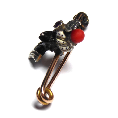 498 - A BIMETAL, ENAMEL, AMETHYST AND CORAL VENETIAN BLACKAMOOR STICKPIN
A black enamel female bust with w... 