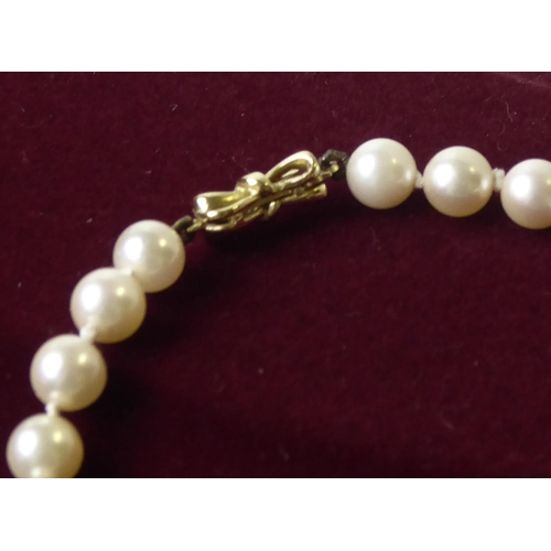 510 - WITHDRAWN A 9CT GOLD AND PEARL NECKLACE
The single strand of cultured pearls with a bow form gold cl... 