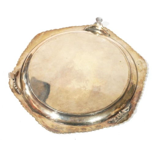 518 - AN EDWARDIAN SILVER SALVER
Gadrooned edge with shell, on scrolled legs.
(approx 22cm)