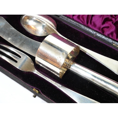 524 - A CASED VICTORIAN SILVER CHRISTENING SET
Comprising a pistol grip knife, fork, spoon and serviette r... 