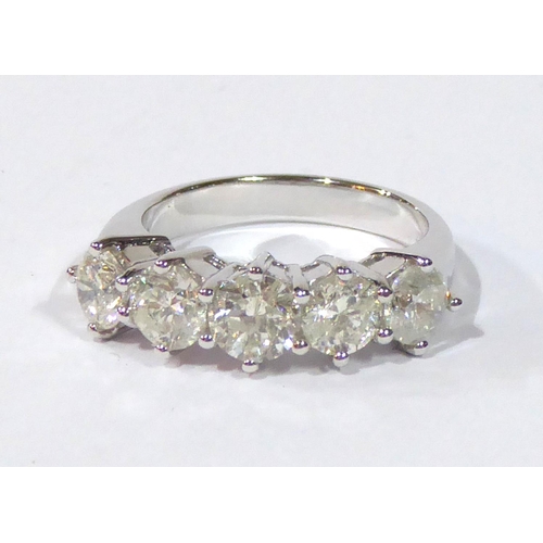 535 - AN IMPRESSIVE 18CT WHITE GOLD RING SET WITH FIVE DIAMONDS 
(size M).
(2.5ct in total) (colour H, S2)