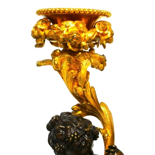 564 - A FINE AND IMPRESSIVE PAIR OF 19TH CENTURY GILT AND PATINATED BRONZE CANDELABRA 
With seated putti s... 