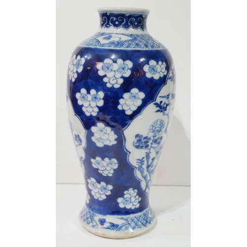 567 - A 19TH CENTURY CHINESE BLUE AND WHITE PORCELAIN BALUSTER VASE
With flowers and fauna, bearing a four... 