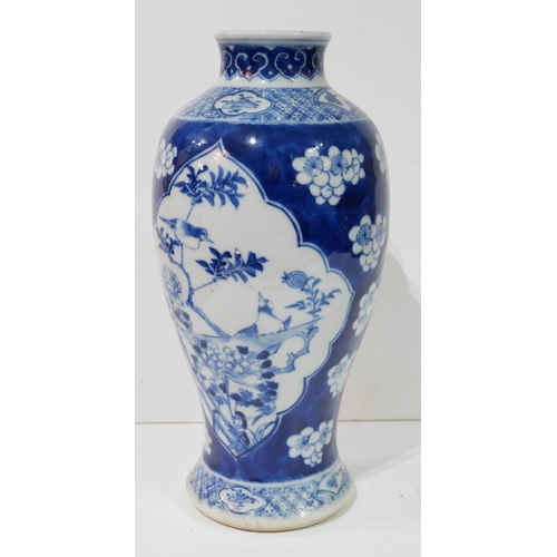 567 - A 19TH CENTURY CHINESE BLUE AND WHITE PORCELAIN BALUSTER VASE
With flowers and fauna, bearing a four... 