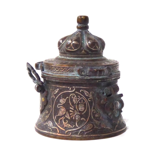 571 - AN ANTIQUE PERSIAN BRONZE AND SILVER CEREMONIAL VESSEL
Having a done form lid and silver wire decora... 