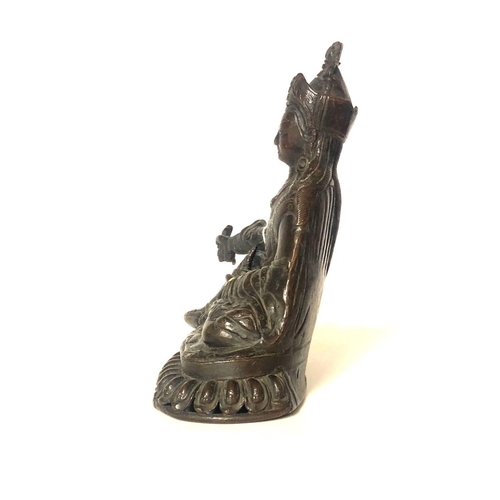 574 - AN ANTIQUE NEPALESE-TIBETAN BRONZE FIGURE OF BUDDHA AMITAYUS
Wearing a long Monks robe and tiara, hi... 