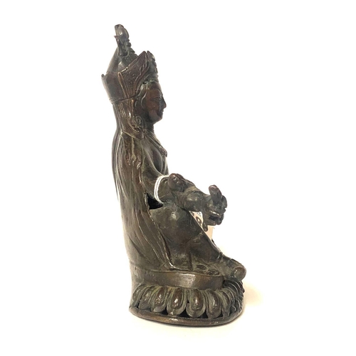 574 - AN ANTIQUE NEPALESE-TIBETAN BRONZE FIGURE OF BUDDHA AMITAYUS
Wearing a long Monks robe and tiara, hi... 