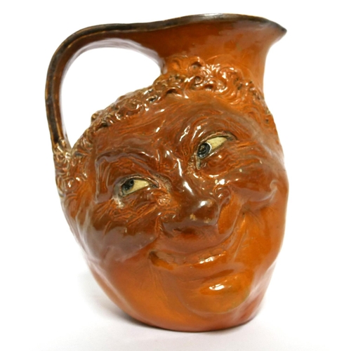 584 - MARTIN BROTHERS, BRITISH, ESTABLISHED 1873, A LARGE GLAZED STONEWARE DOUBLE FACE JUG
Signed with inc... 