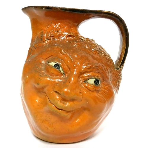 584 - MARTIN BROTHERS, BRITISH, ESTABLISHED 1873, A LARGE GLAZED STONEWARE DOUBLE FACE JUG
Signed with inc... 