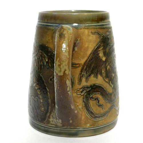 587 - MARTIN BROTHERS, BRITISH, ESTABLISHED 1873, A STONEWARE GLAZED TANKARD
The incised decoration in the... 