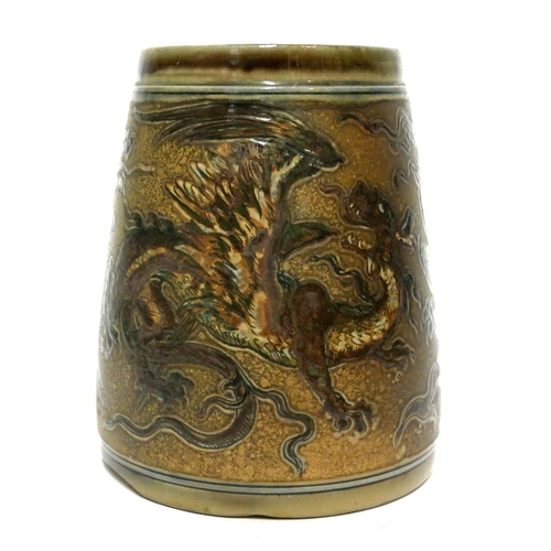 587 - MARTIN BROTHERS, BRITISH, ESTABLISHED 1873, A STONEWARE GLAZED TANKARD
The incised decoration in the... 